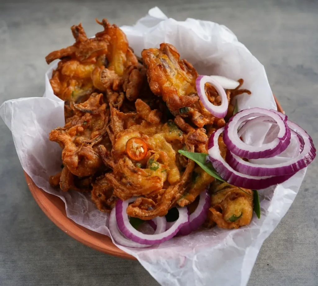 10 Easy Air Fryer Desi Snacks Recipes for Guilt-Free Tea Time 1 - crispy onion pakora result - Desi Cooking Academy crispy-onion-pakora